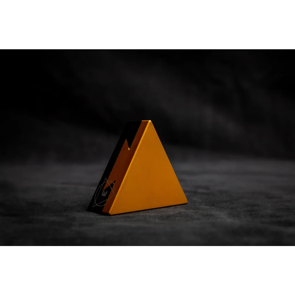 CRYPT3D, crypted is a mechanical puzzle dovetail triangle in royal gold and black on black background
